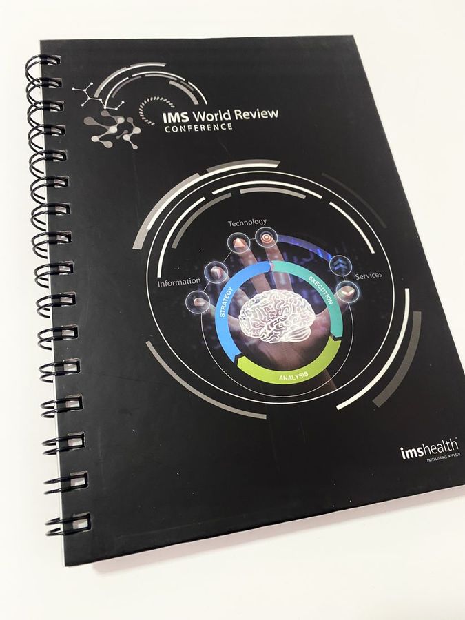 Cuaderno anillado impreso para la conferencia IMS World Review